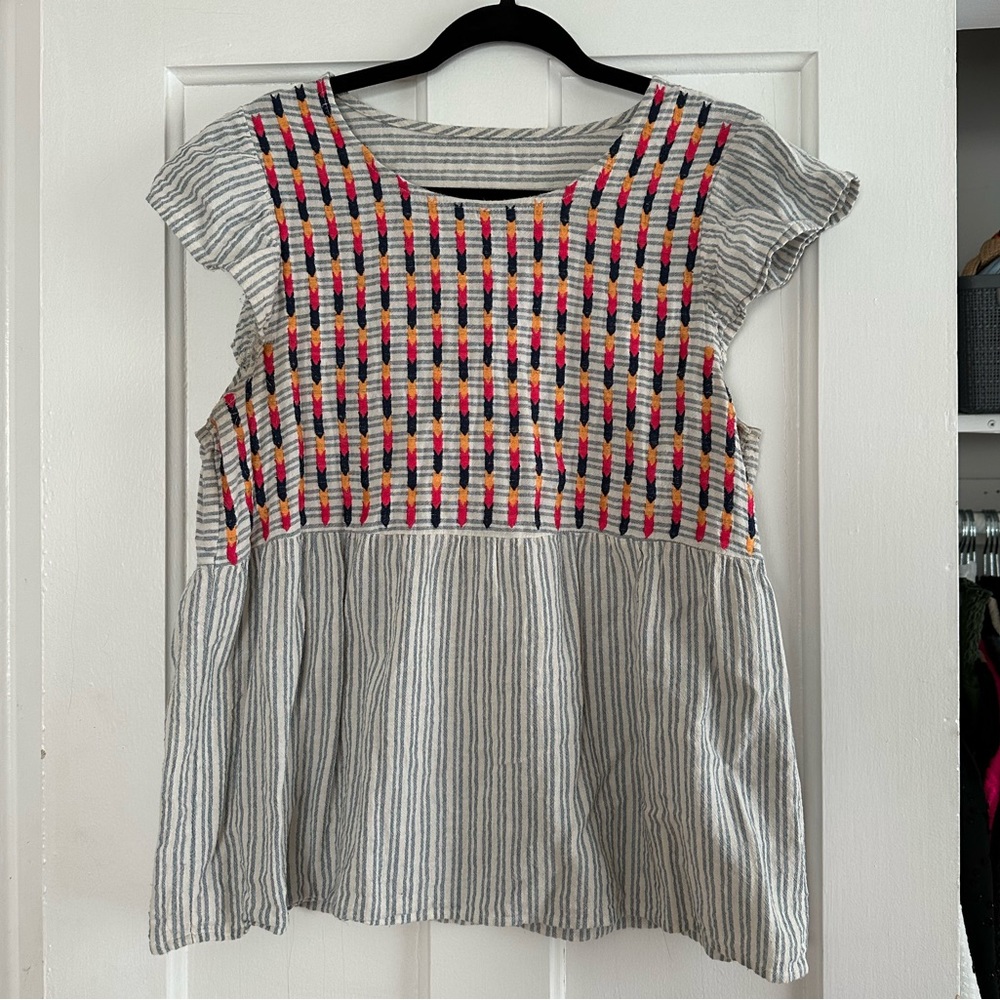 Embroidered flutter sleeve top